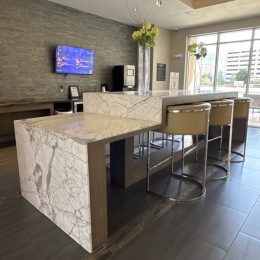 a granite kitchen island with barstools