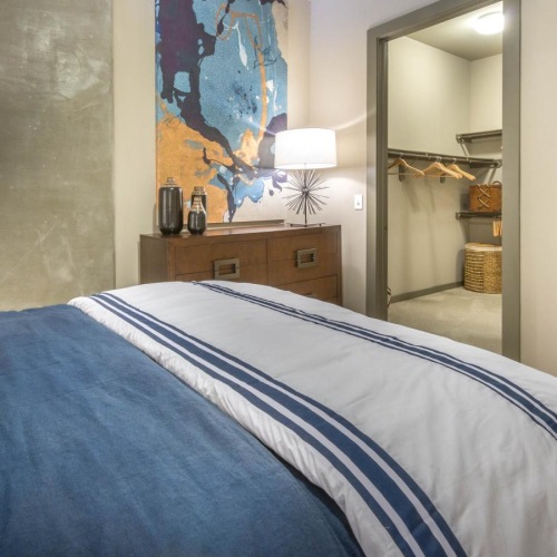 a bedroom with a bed and closet access