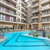 a swimming pool by a large building