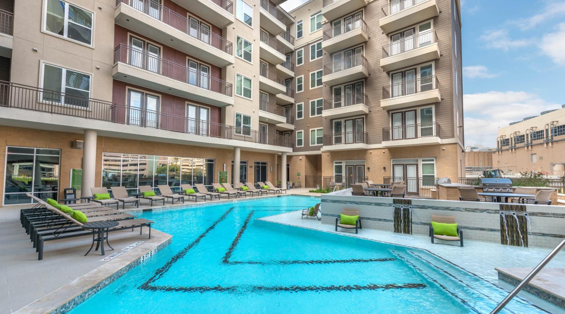 a swimming pool by a large building